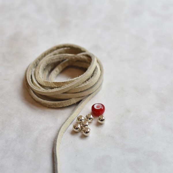 White Deerskin String and Red White Heart Bead