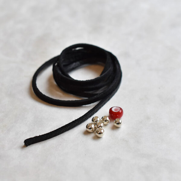 Black Deerskin String and Red White Heart Bead